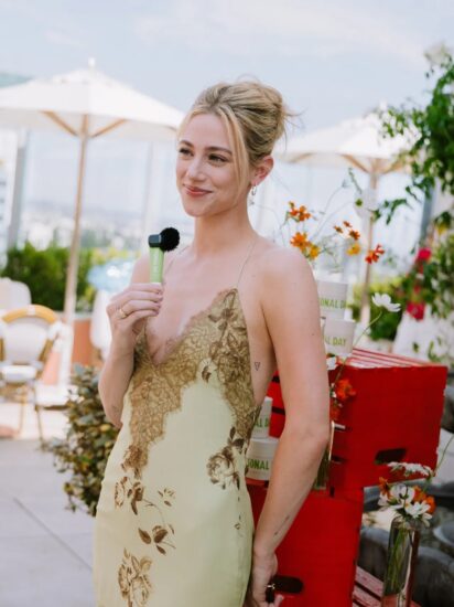 Lili Reinhart lovely in a lace-trimmed slip gown at the Personal Day Overdew launch in Los Angeles