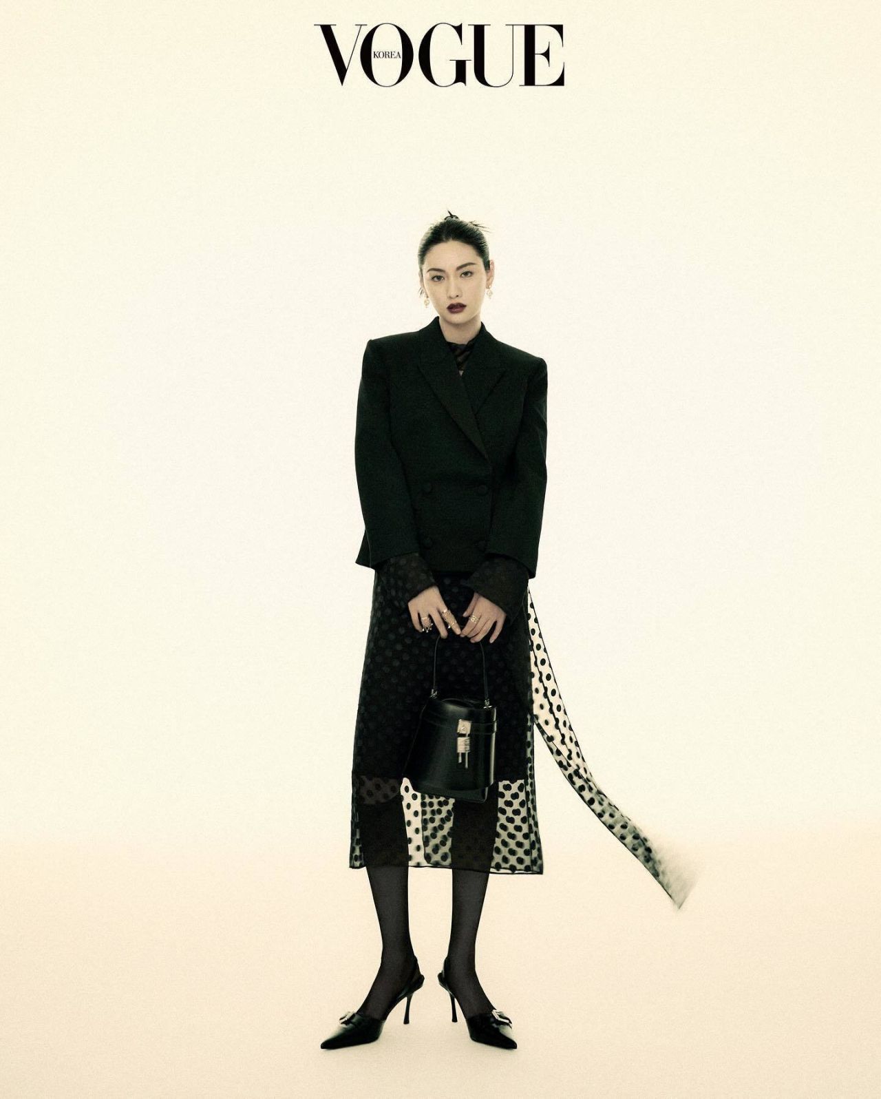 Nana in a black tailored suit and tie for Vogue Korea, June 2024