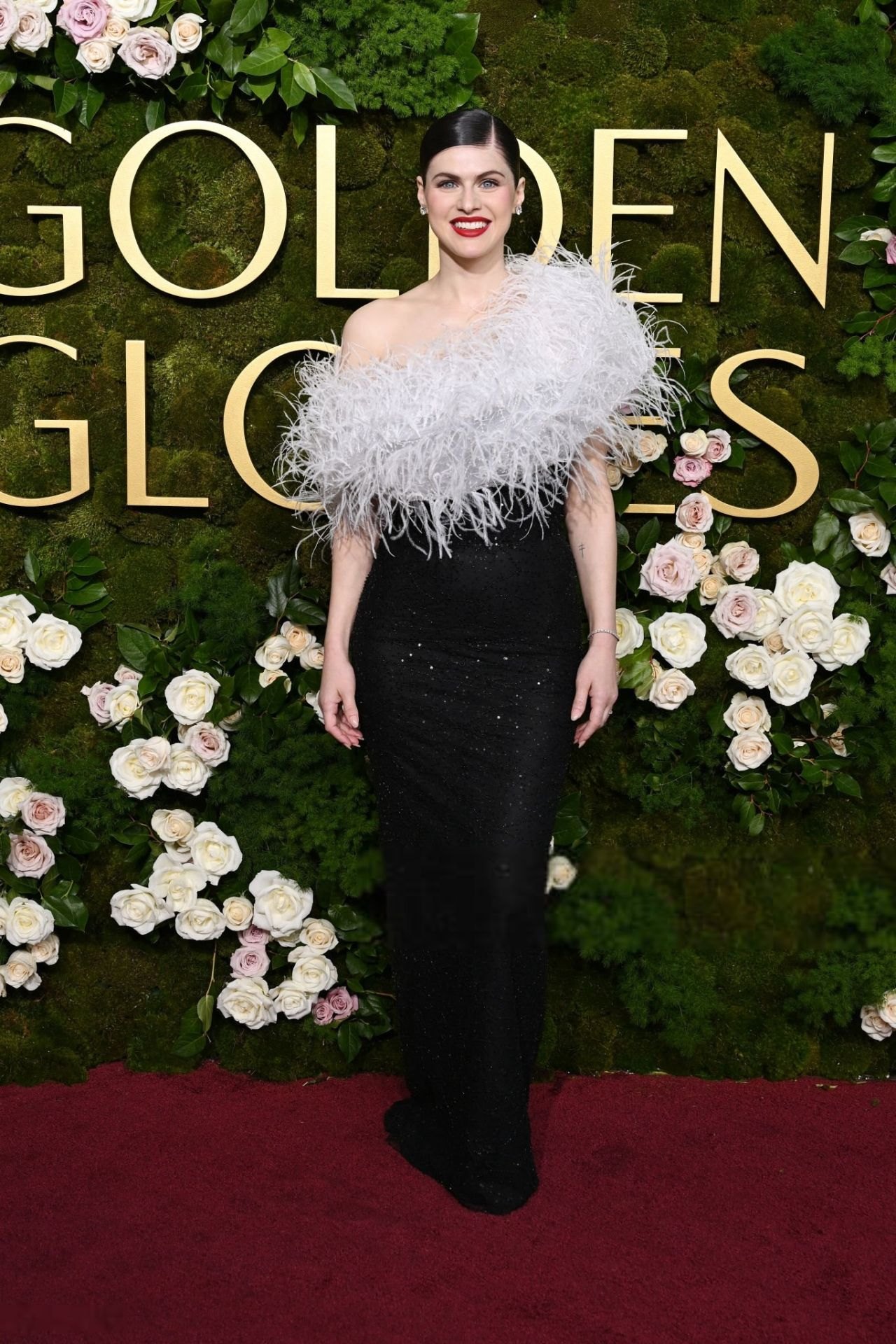 Alexandra Daddario in custom Vivienne Westwood with white feathers at the 2025 Golden Globes