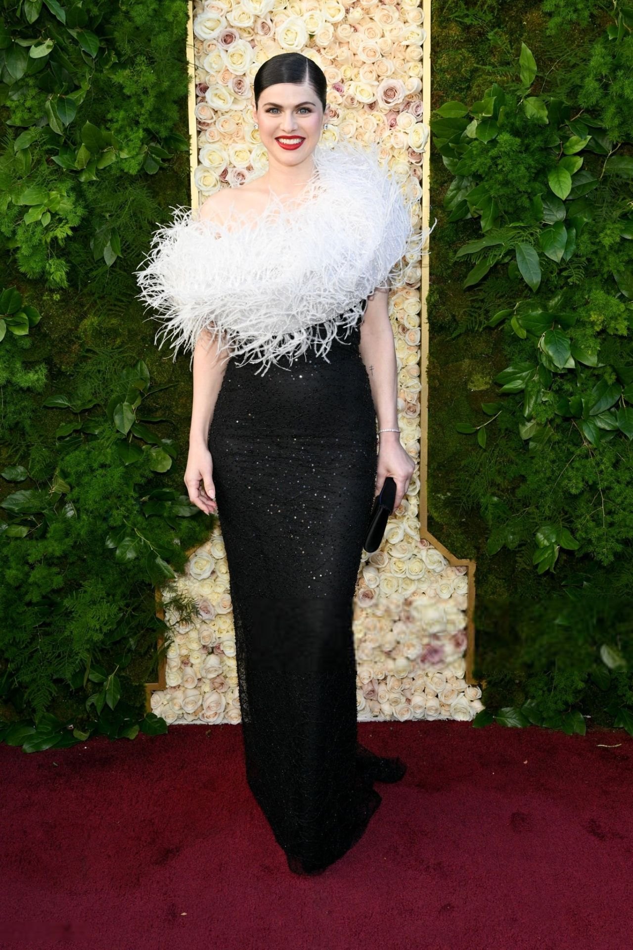 Alexandra Daddario on the Golden Globes 2025 red carpet in Vivienne Westwood