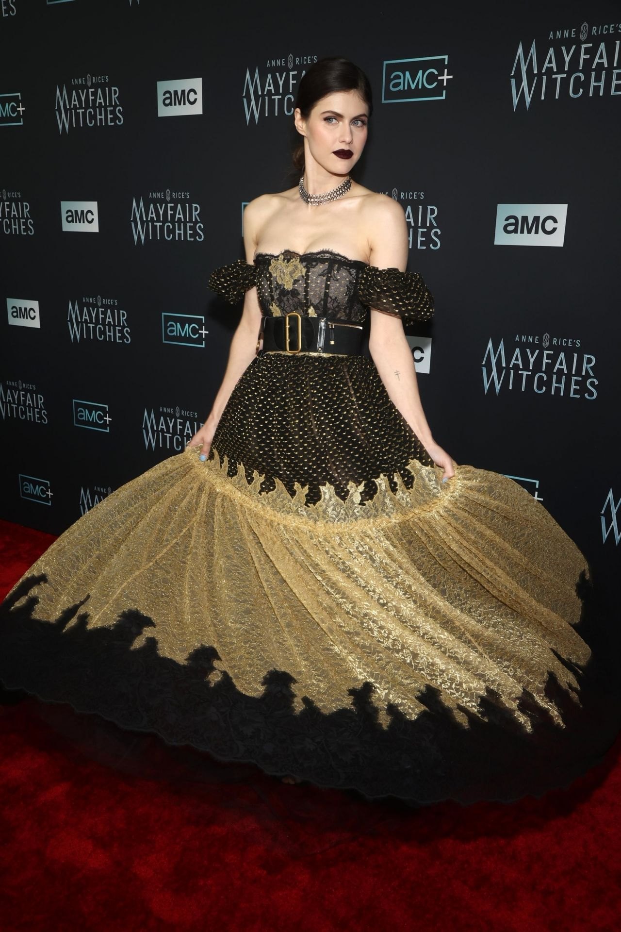 Alexandra Daddario in a black corset and gold skirt at the Mayfair Witches premiere, December 2022