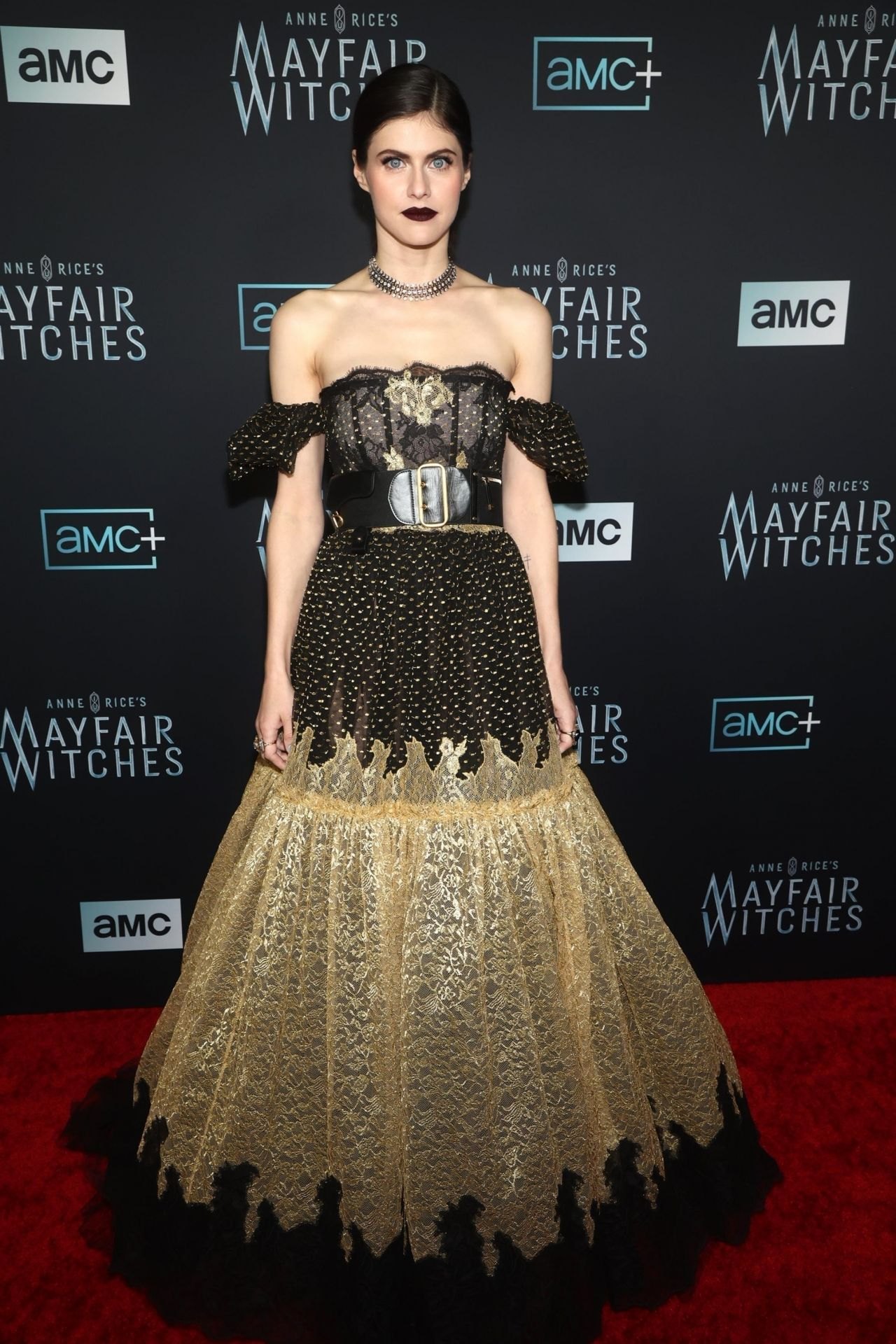 Alexandra Daddario twirling her gold skirt at the Mayfair Witches premiere