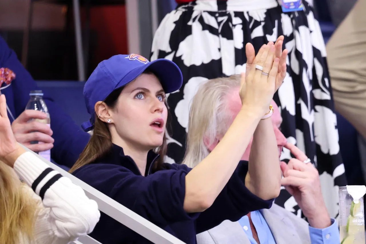 Alexandra Daddario taking a selfie with fans at the US Open 2026