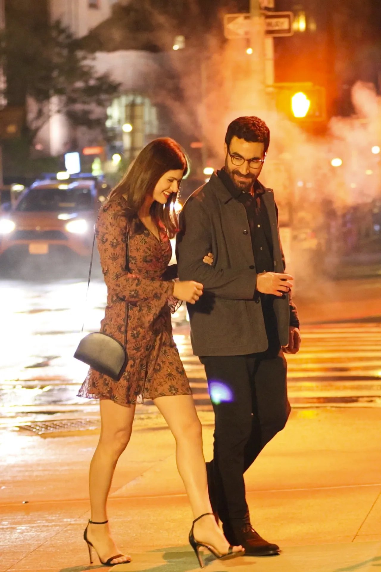 Alexandra Daddario with her co-star at night filming Escorted
