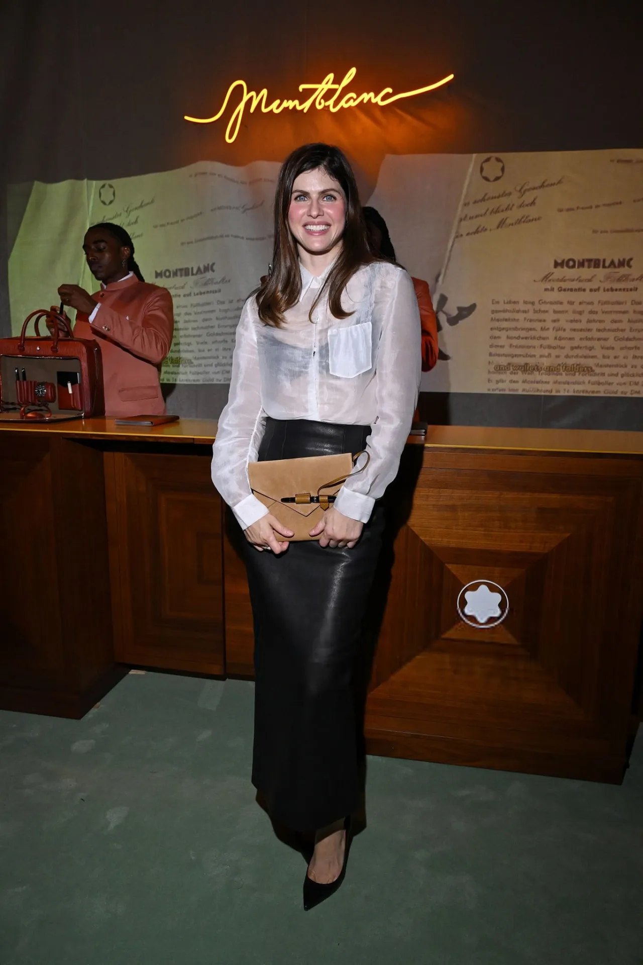 Alexandra Daddario full length in a sheer white shirt at Montblanc, 2026