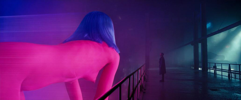 Joi bent along the Blade Runner walkway, bare