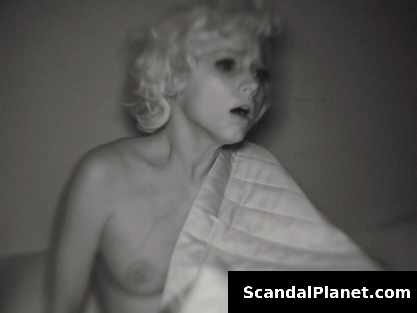Marilyn in Blonde, the sheet slipping off her breast