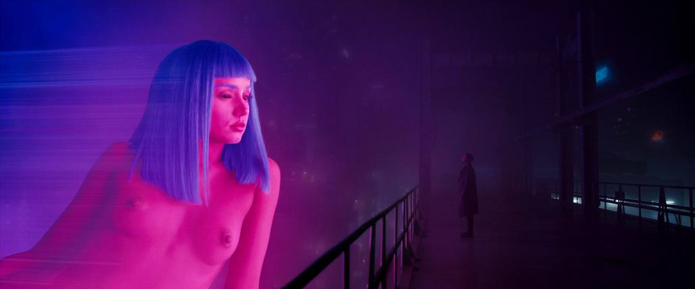 Joi on the Blade Runner billboard, face and breasts in the pink light