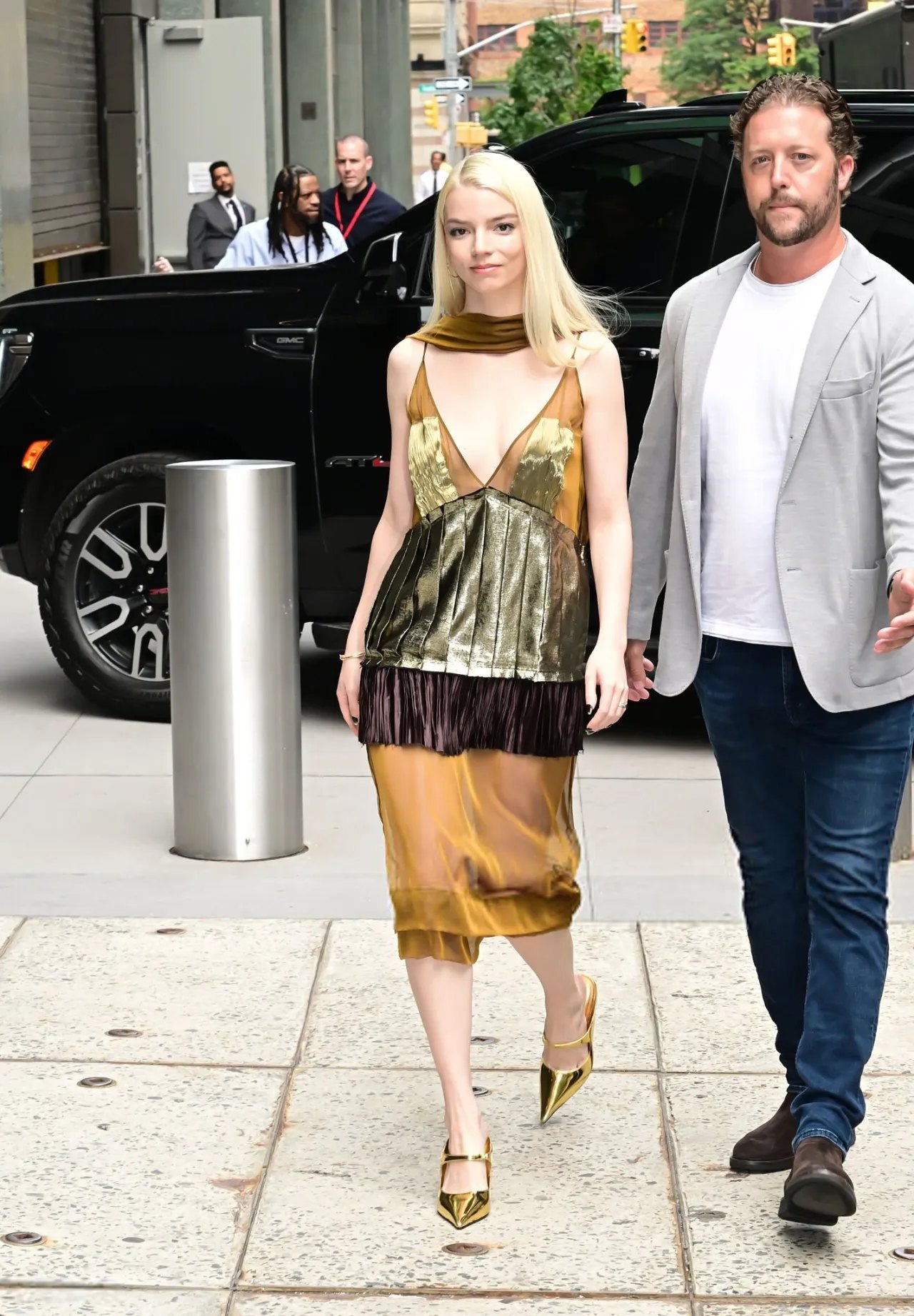 Anya Taylor-Joy in a gold Ferragamo outfit outside The View in New York, July 2026, photo 4