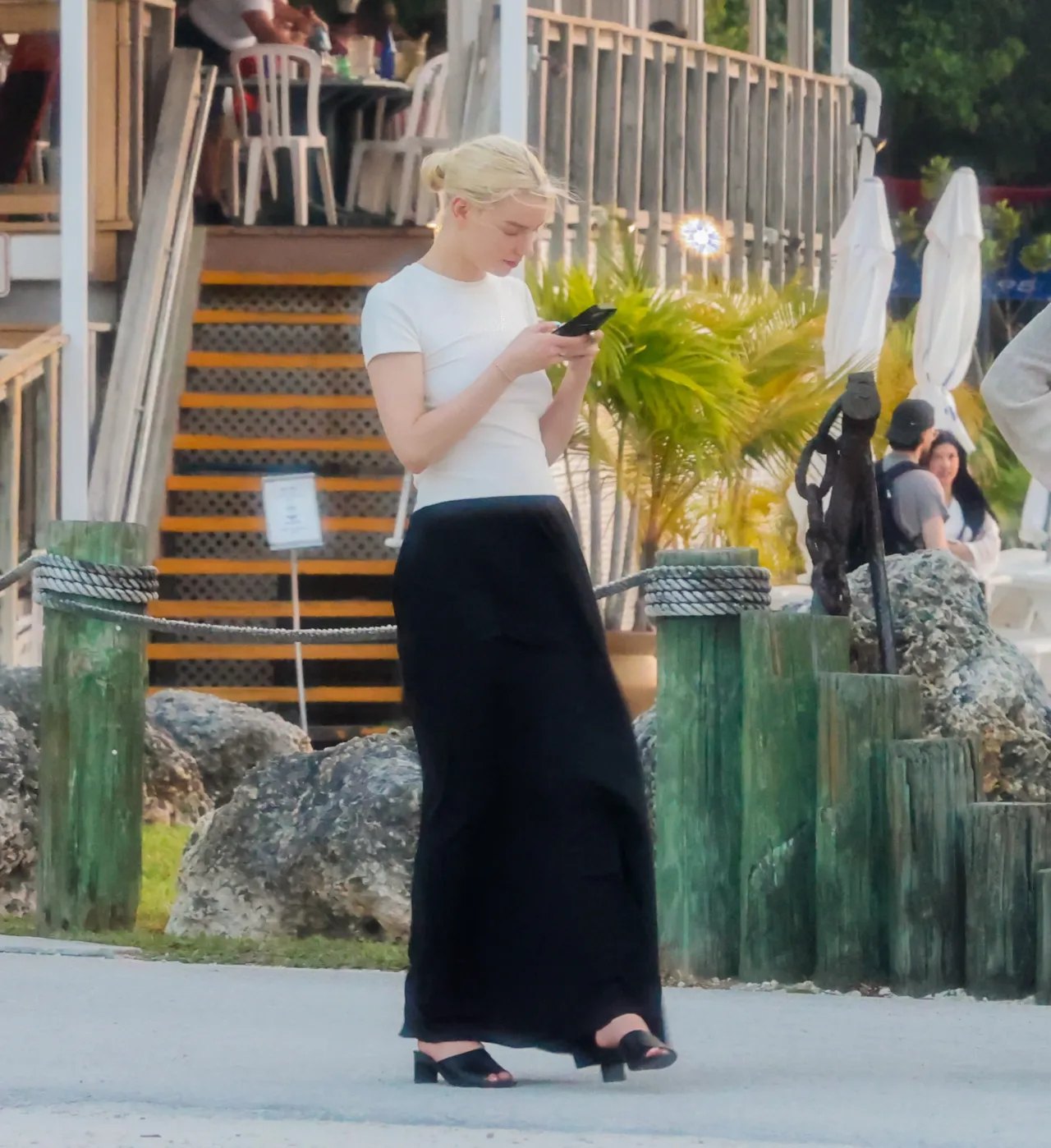 Anya Taylor-Joy in a white T-shirt and black maxi skirt in Key Biscayne, 2026, photo 4