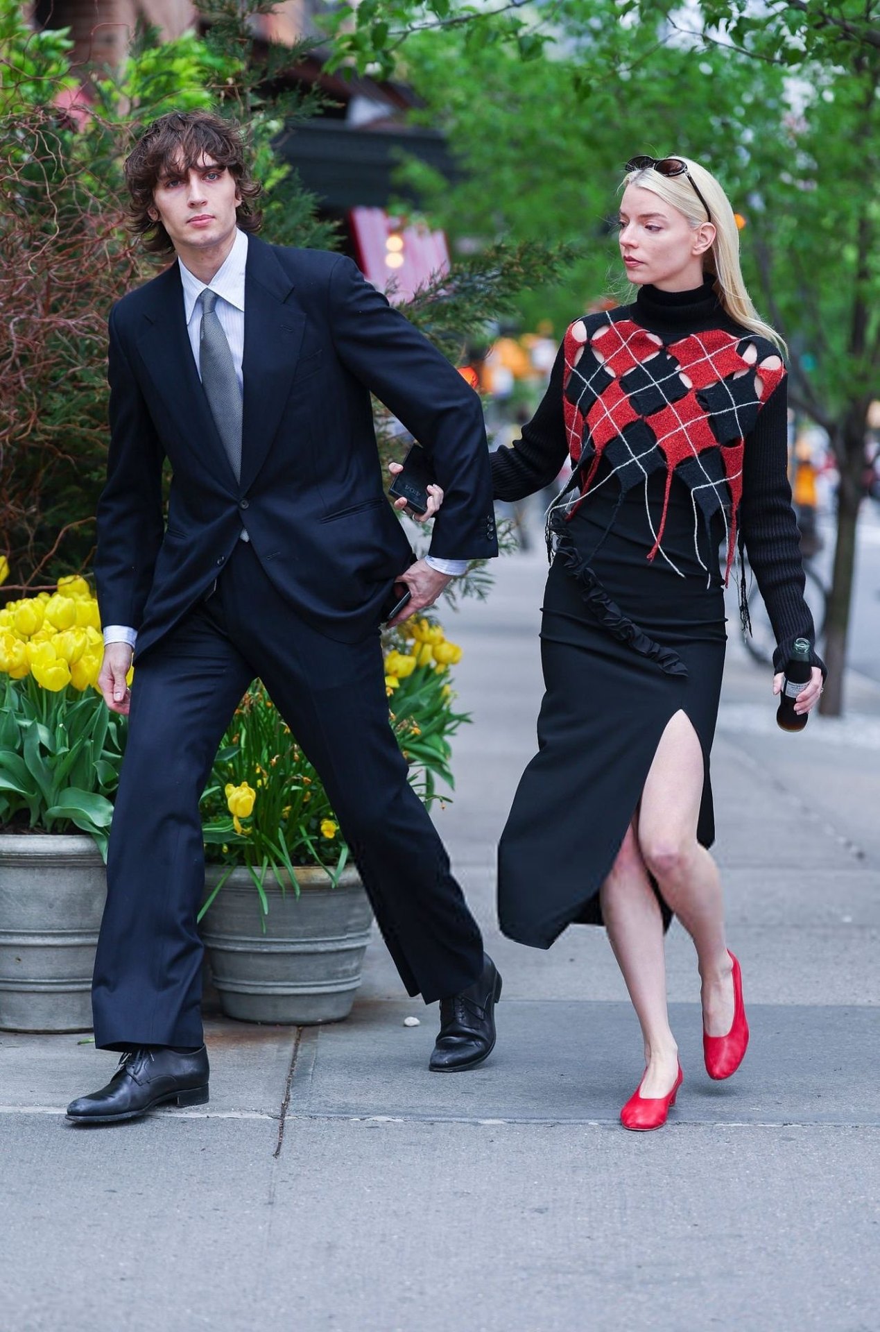 Anya Taylor-Joy in a red and black outfit with Malcolm McRae in New York, 2025, photo 2