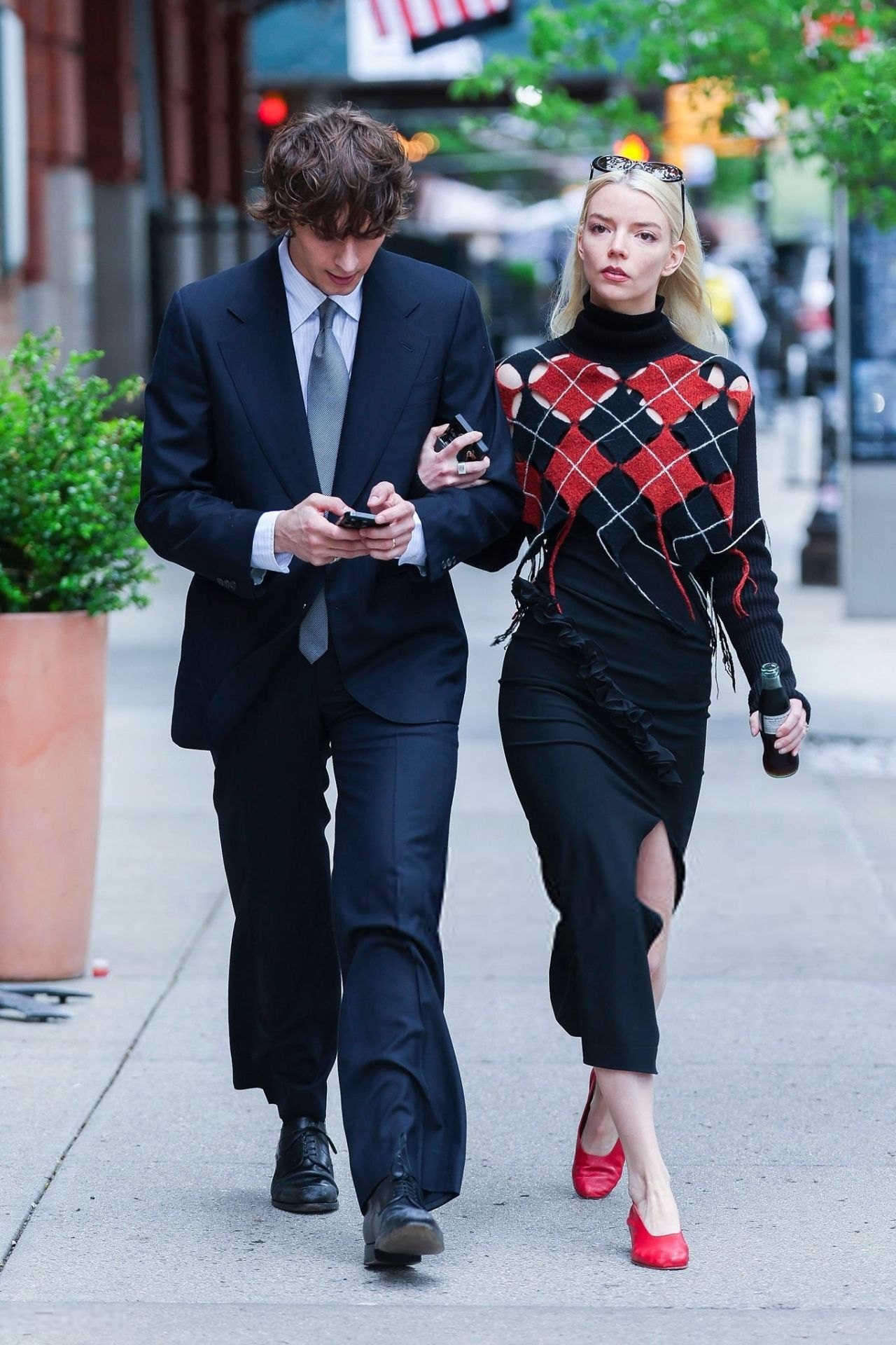 Anya Taylor-Joy in a red and black outfit with Malcolm McRae in New York, 2025, photo 4