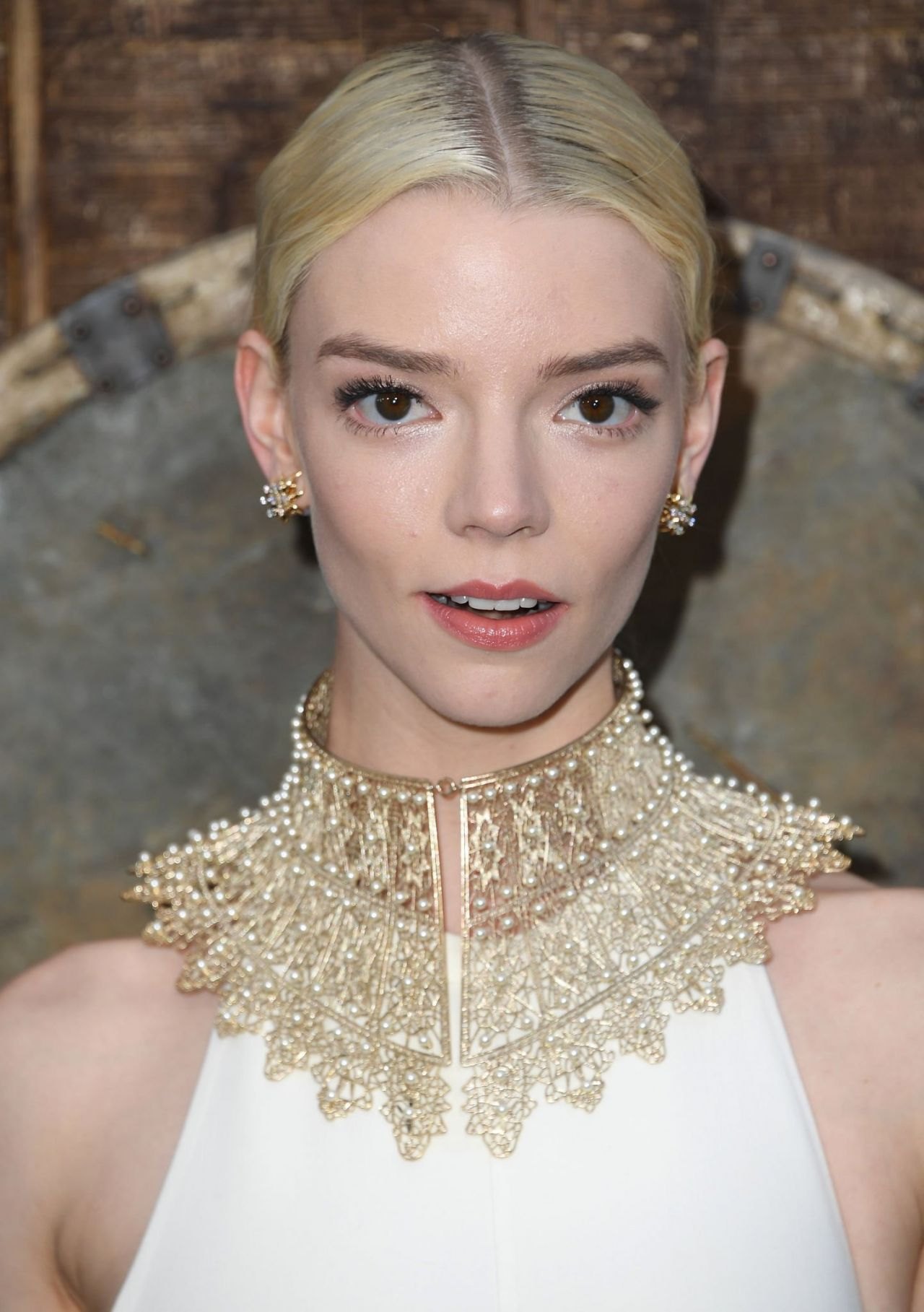 Anya Taylor-Joy in a white gown with a gold collar at The Northman premiere in Hollywood, April 2022, photo 2