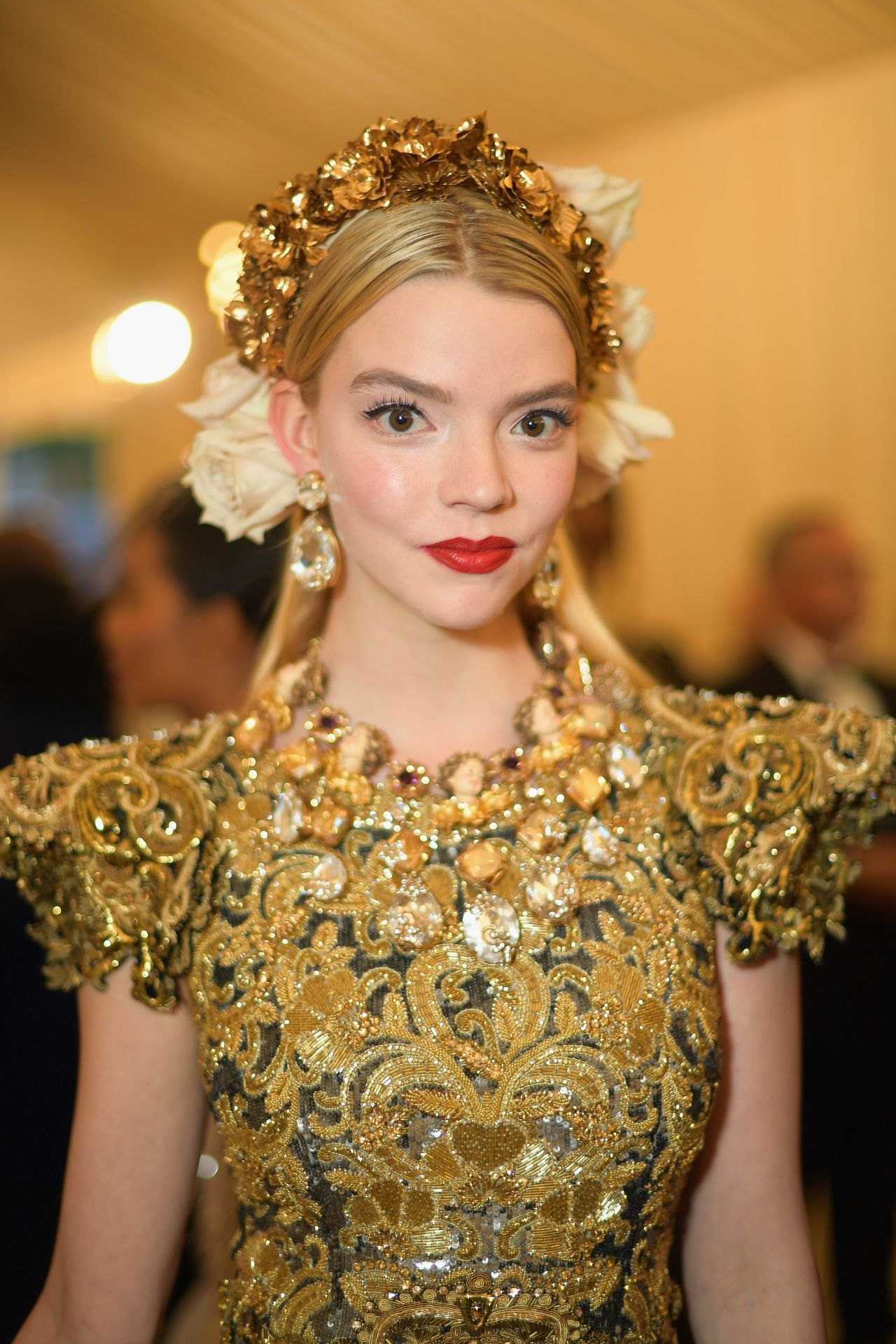 Anya Taylor-Joy in a gold gown and floral crown at the 2018 Met Gala, photo 2