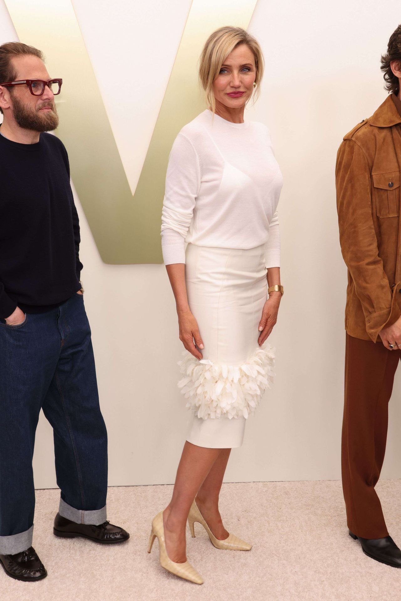 Cameron Diaz at Apple TV press day in a feather-trimmed white look, 2026