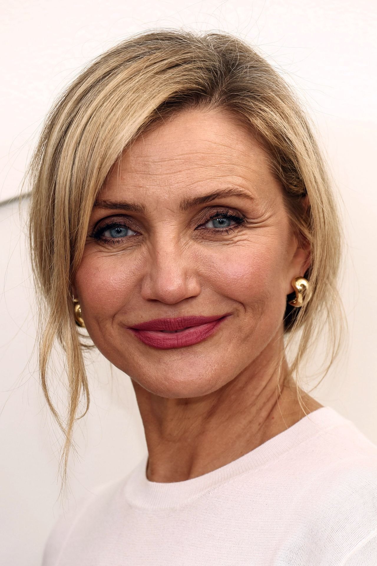 Cameron Diaz at Apple TV press day in a feather-trimmed white look, 2026, photo 4