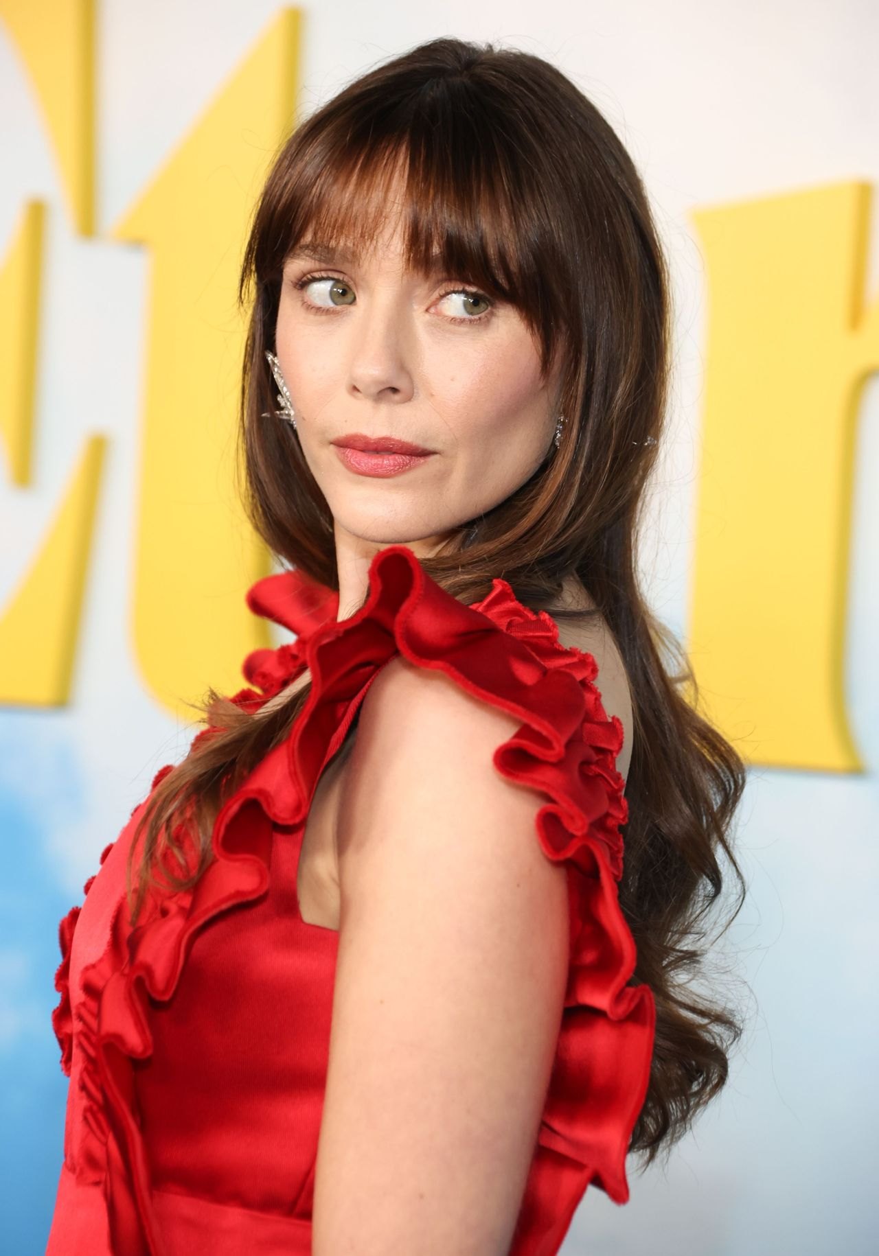 Elizabeth Olsen in a red ruffled dress at an A24 Eternity screening in Los Angeles, 2025, photo 3