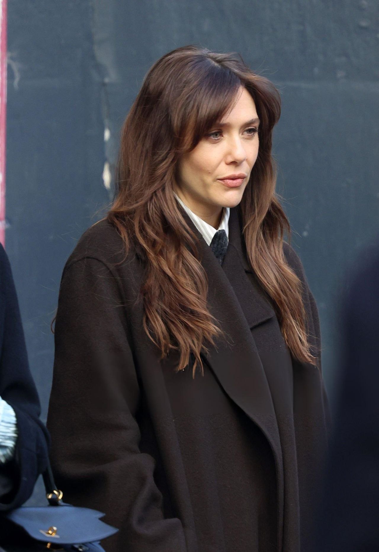 Elizabeth Olsen in a long brown coat leaving Heart Radio studios in London, 2025, photo 2