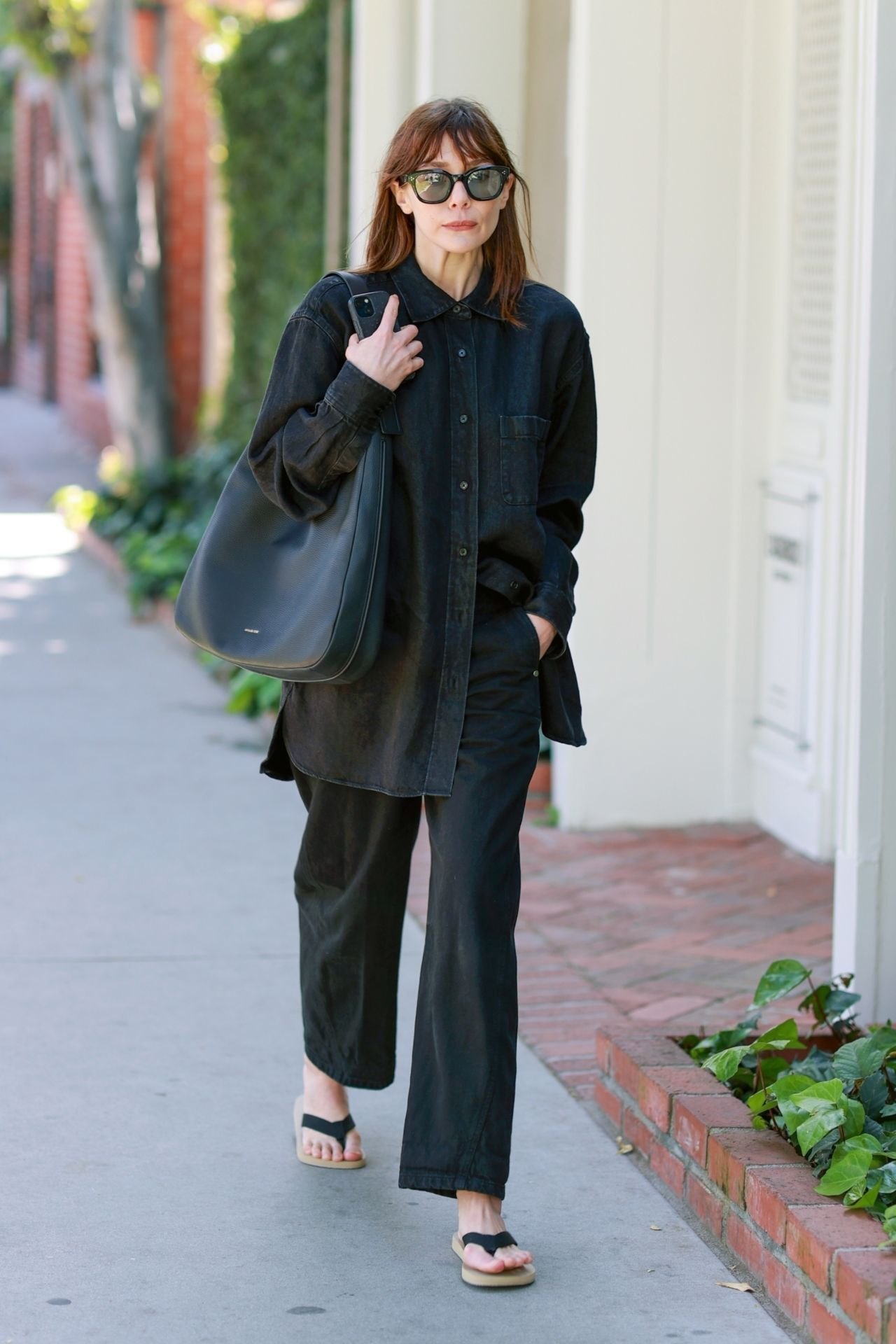 Elizabeth Olsen in an all-black outfit on Melrose Place, April 2025