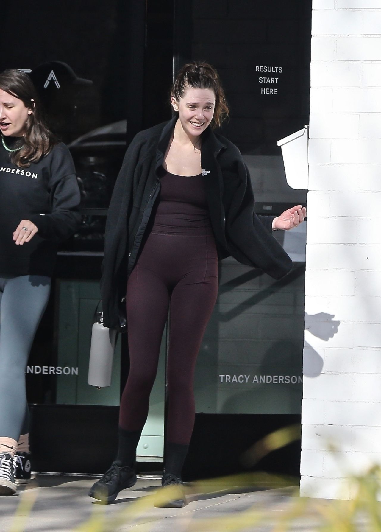 Elizabeth Olsen leaving the gym in a maroon athletic outfit, December 2024, photo 2
