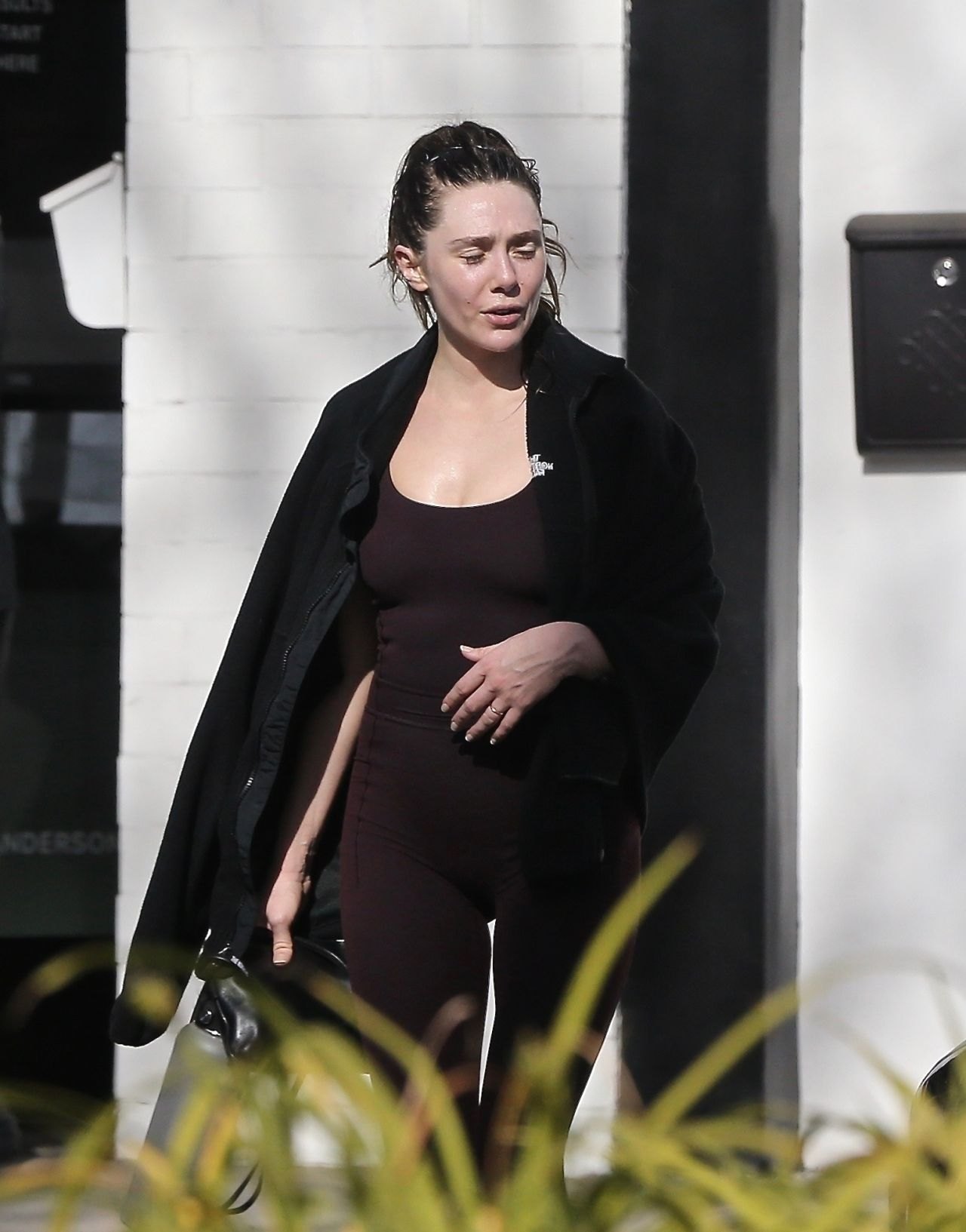 Elizabeth Olsen leaving the gym in a maroon athletic outfit, December 2024, photo 4