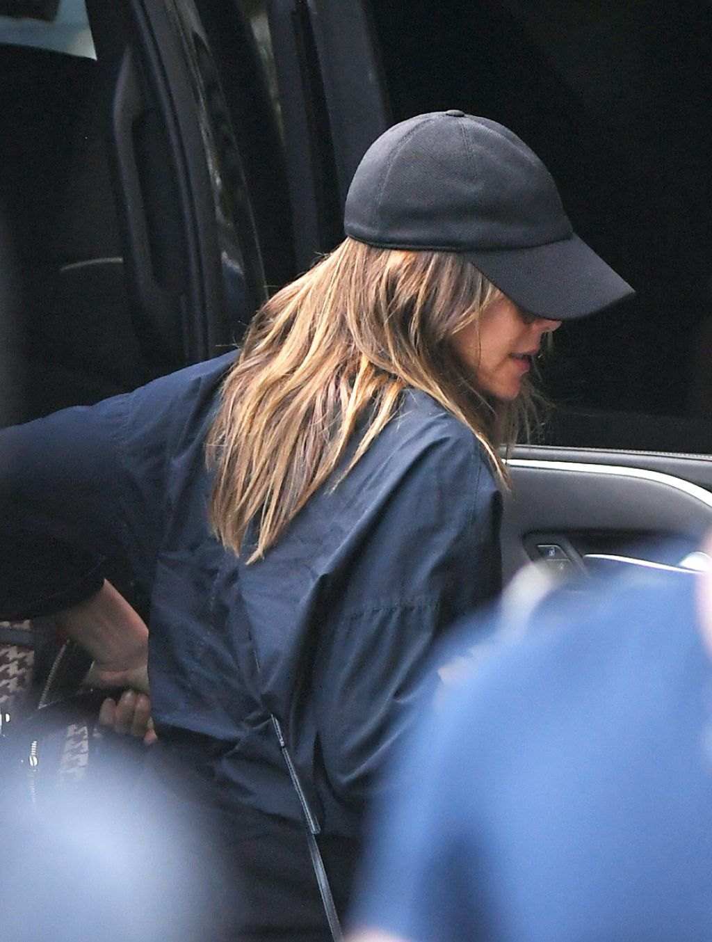 Elizabeth Olsen in a baseball cap out in New York, July 2023