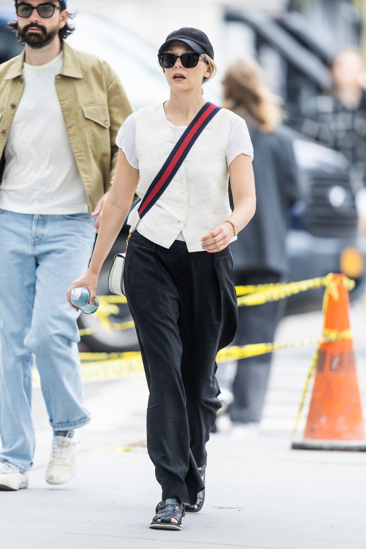 Elizabeth Olsen in a white T-shirt and black trousers in New York, June 2023