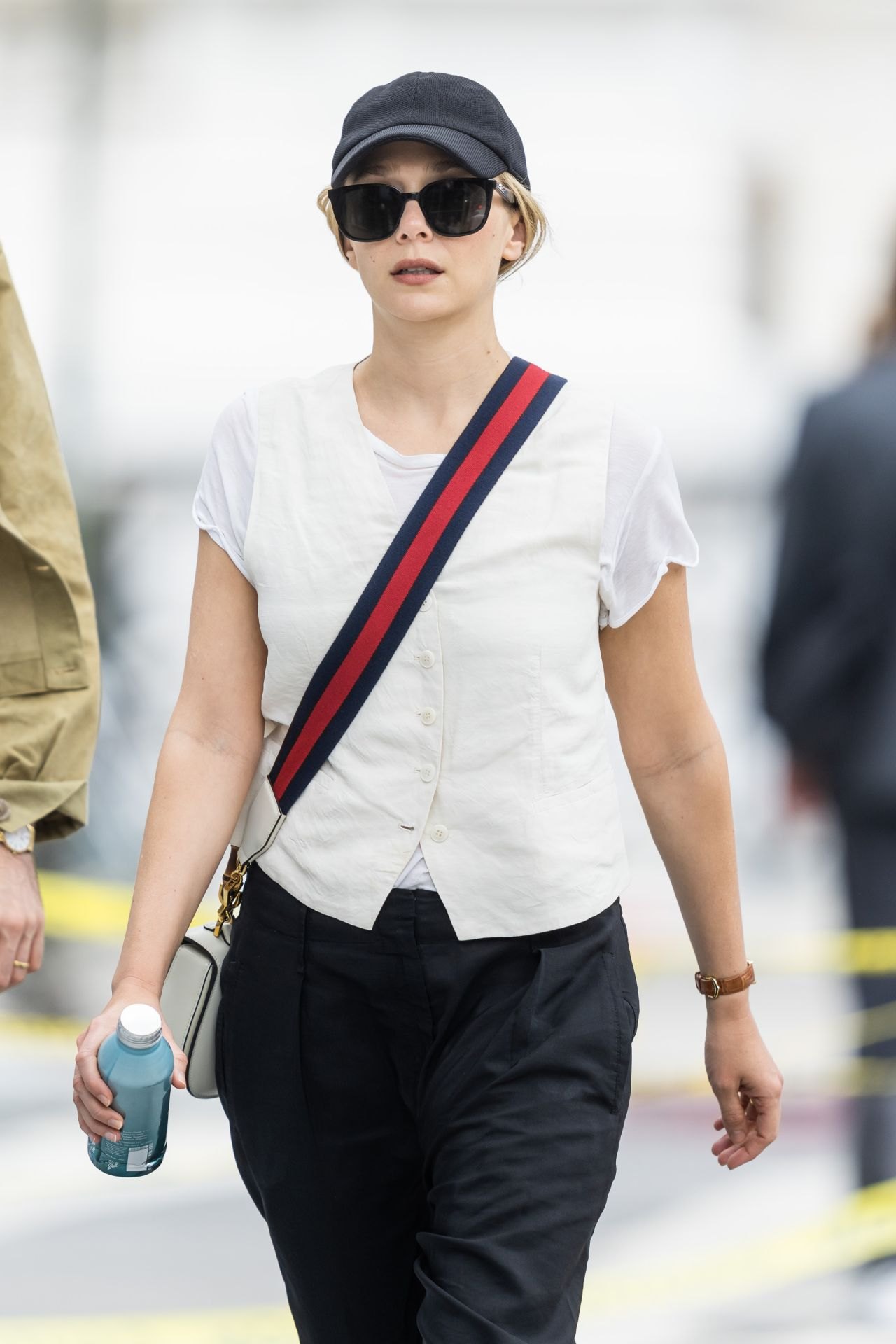 Elizabeth Olsen in a white T-shirt and black trousers in New York, June 2023, photo 3
