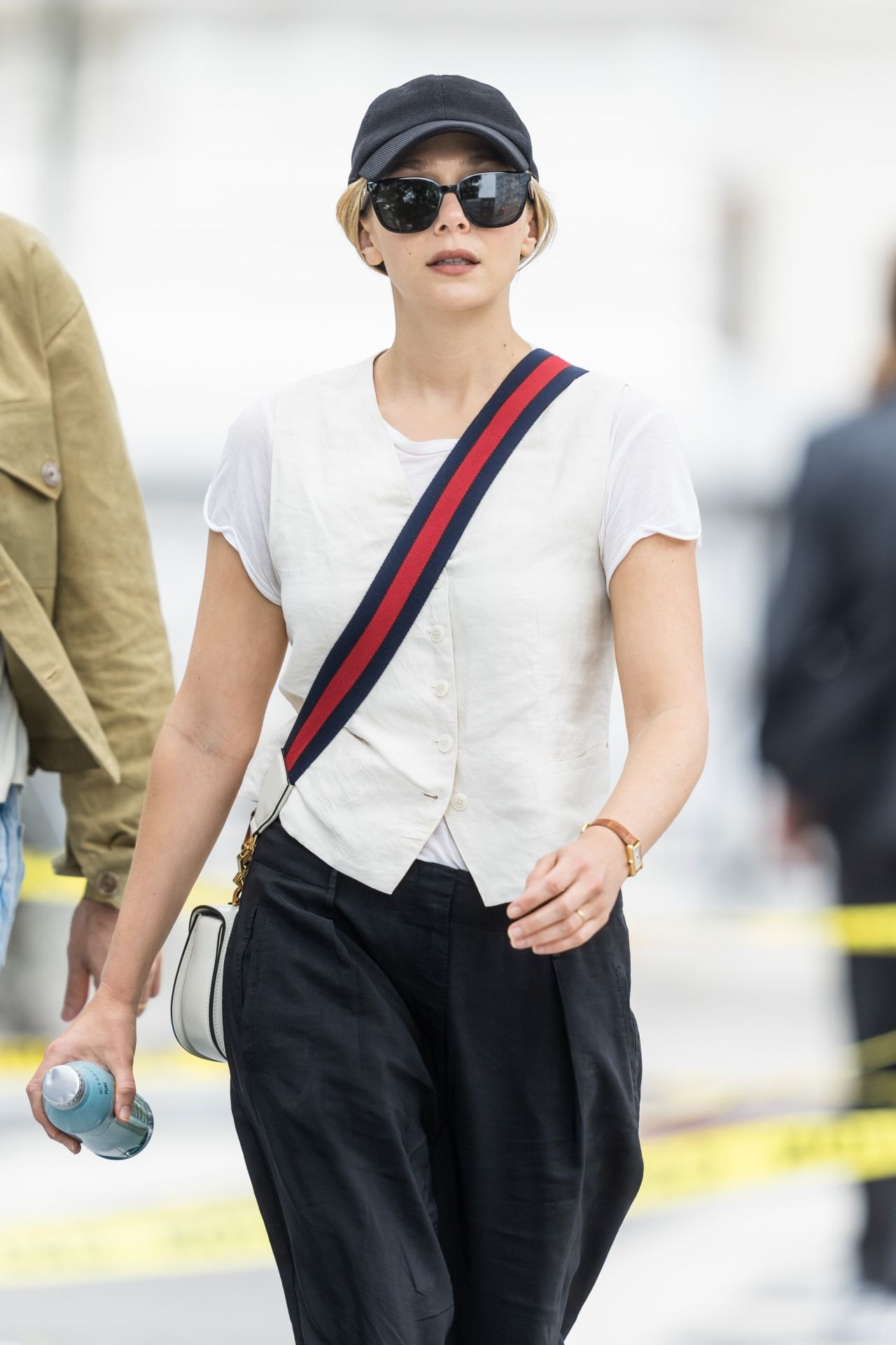 Elizabeth Olsen in a white T-shirt and black trousers in New York, June 2023, photo 4