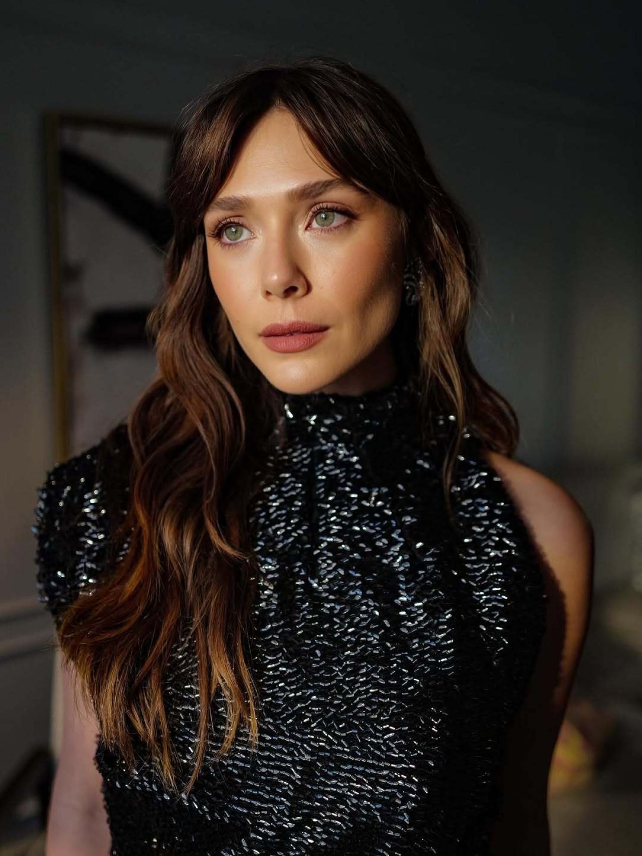 Elizabeth Olsen in a black sequin gown at the Eternity premiere at TIFF, 2025