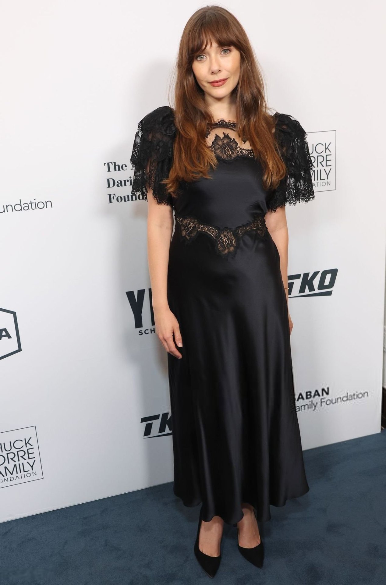 Elizabeth Olsen in a black lace gown at the YES Scholars Gala, 2025