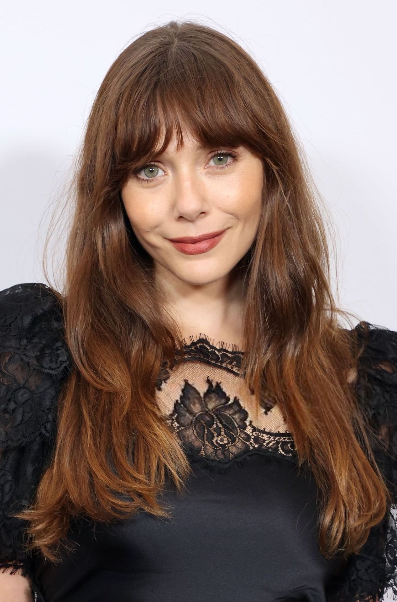 Elizabeth Olsen in a black lace gown at the YES Scholars Gala, 2025, photo 4