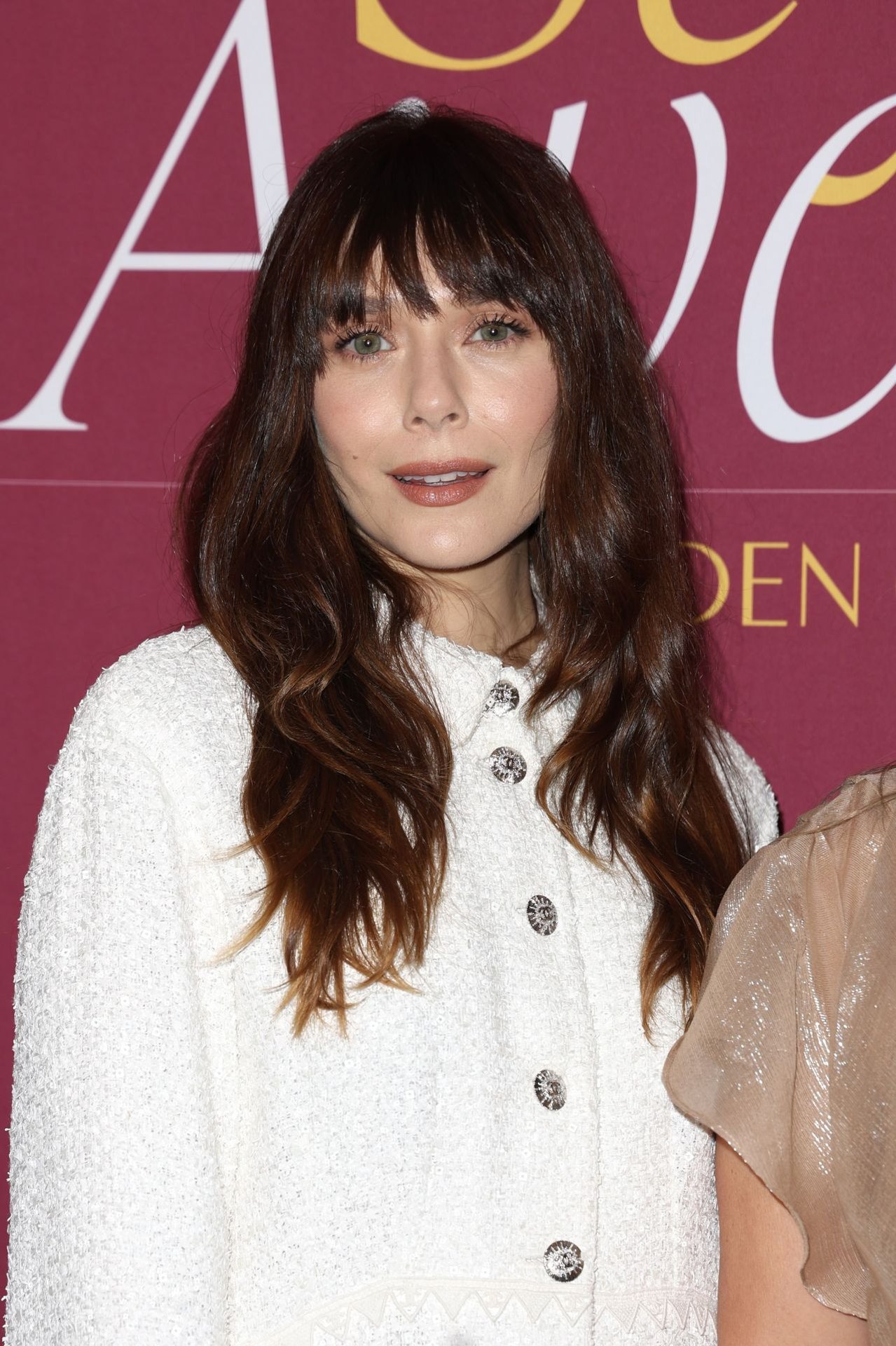Elizabeth Olsen in a white mini dress at the 2025 WWD Style Awards, photo 2
