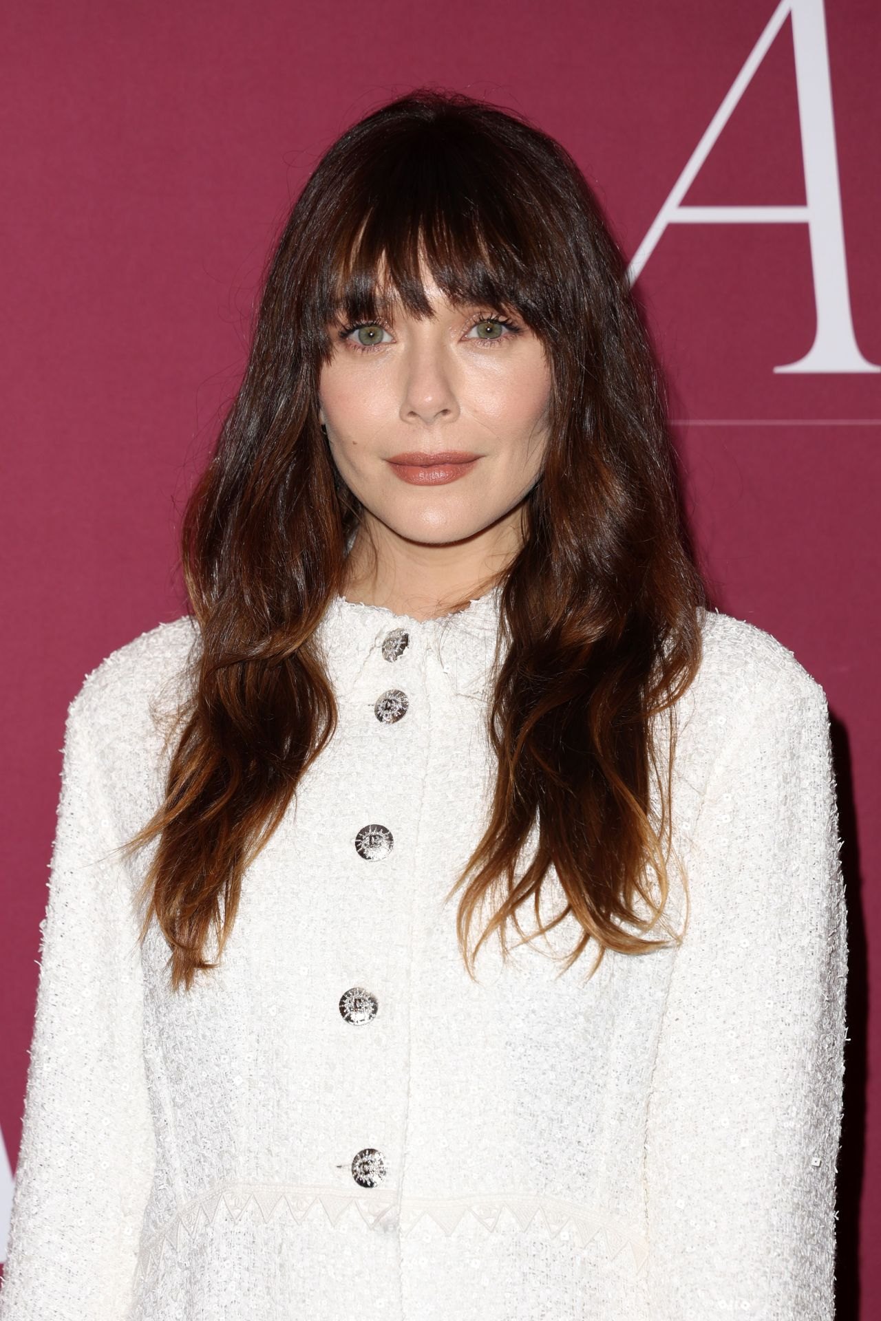 Elizabeth Olsen in a white mini dress at the 2025 WWD Style Awards, photo 4