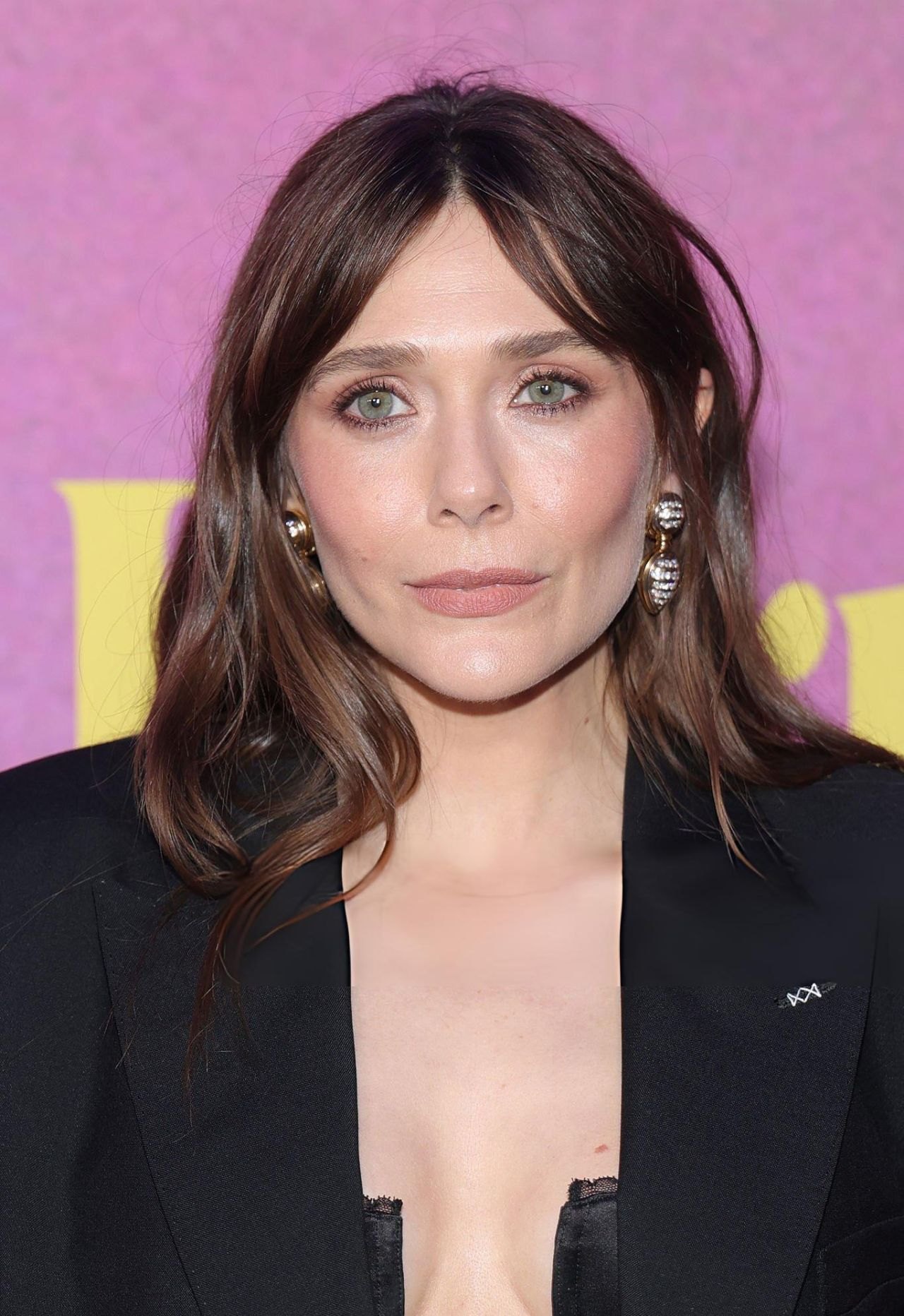 Elizabeth Olsen in a black open blazer and bandeau at the Eternity premiere in New York, 2025, photo 3