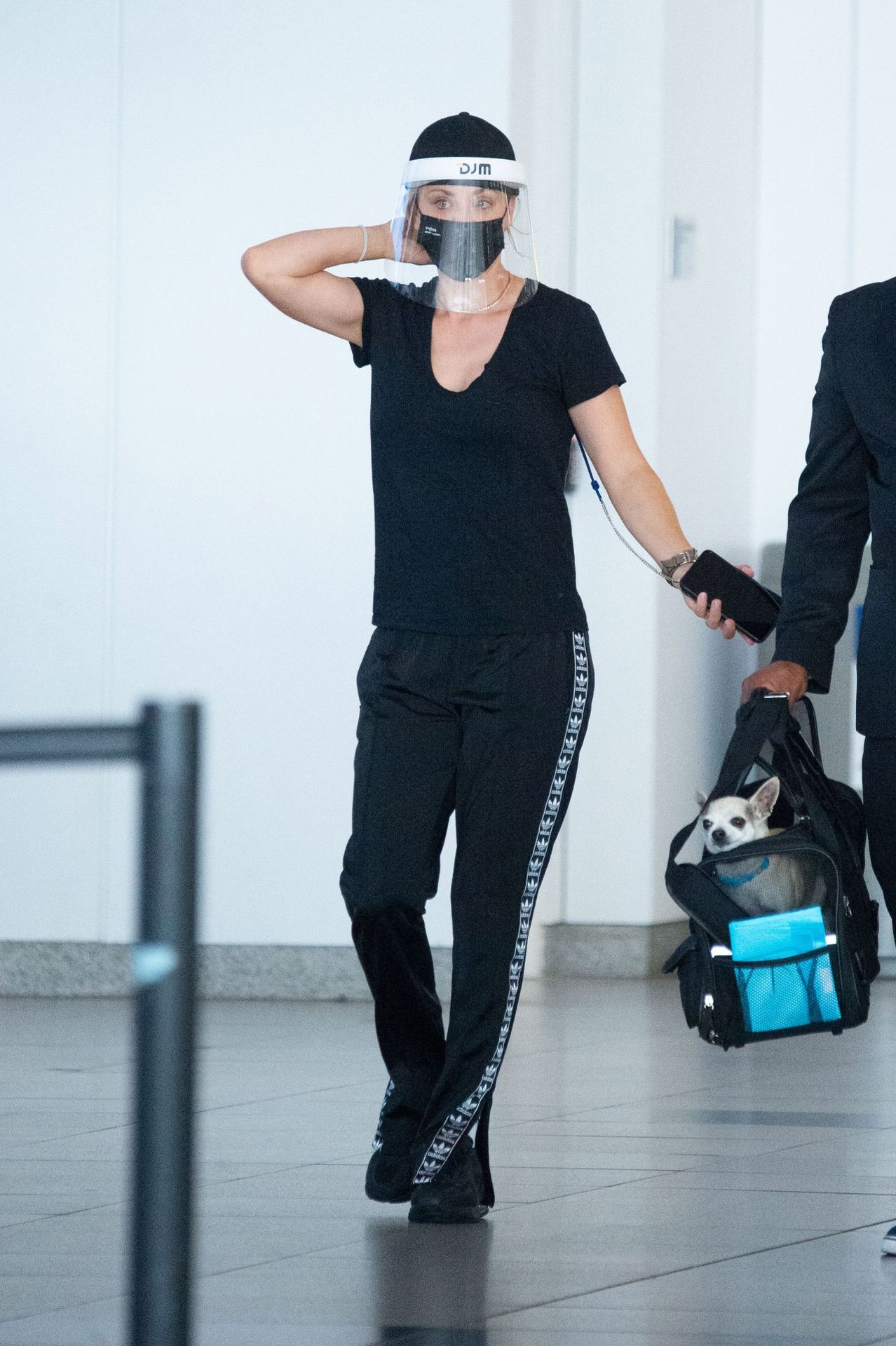 Kaley Cuoco in Travel Outfit - JFK Airport in NYC 08/10/2020