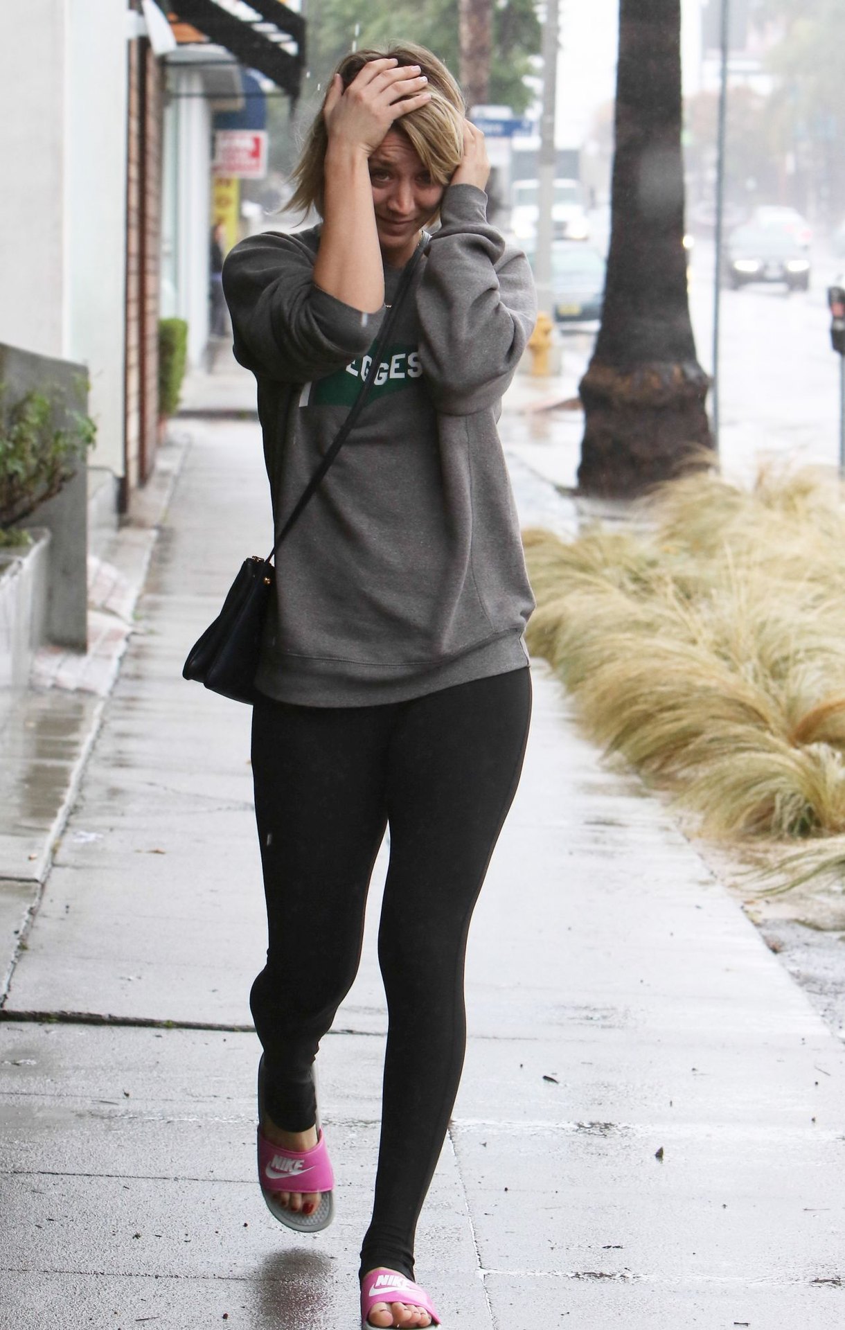 Kaley Cuoco in Spandex - Leaving the Gym Getting Caught in the Rain Without an Umbrella 12/22/2015