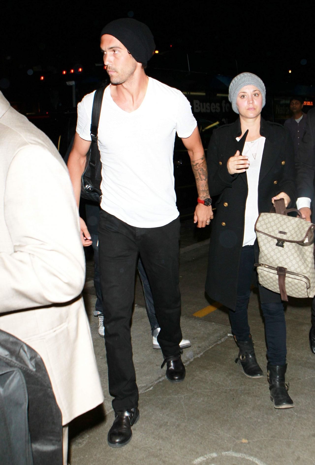 Kaley Cuoco - & Ryan Sweeting - Both Wearing Beanies at LAX Airport - October 2014