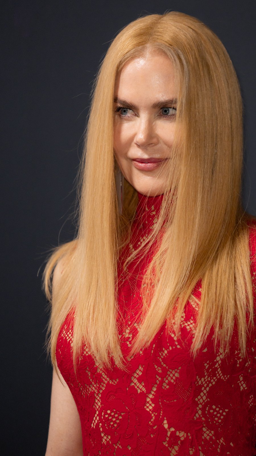 Nicole Kidman with long straight copper-blonde hair in a red lace dress at the Kering Women In Motion event in Cannes 2025
