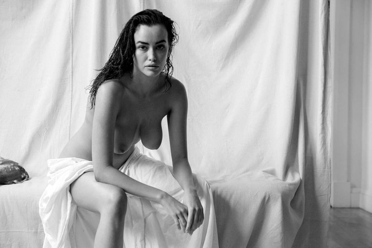 Sarah Stephens nude, wet hair, sheet in her lap, sitting forward