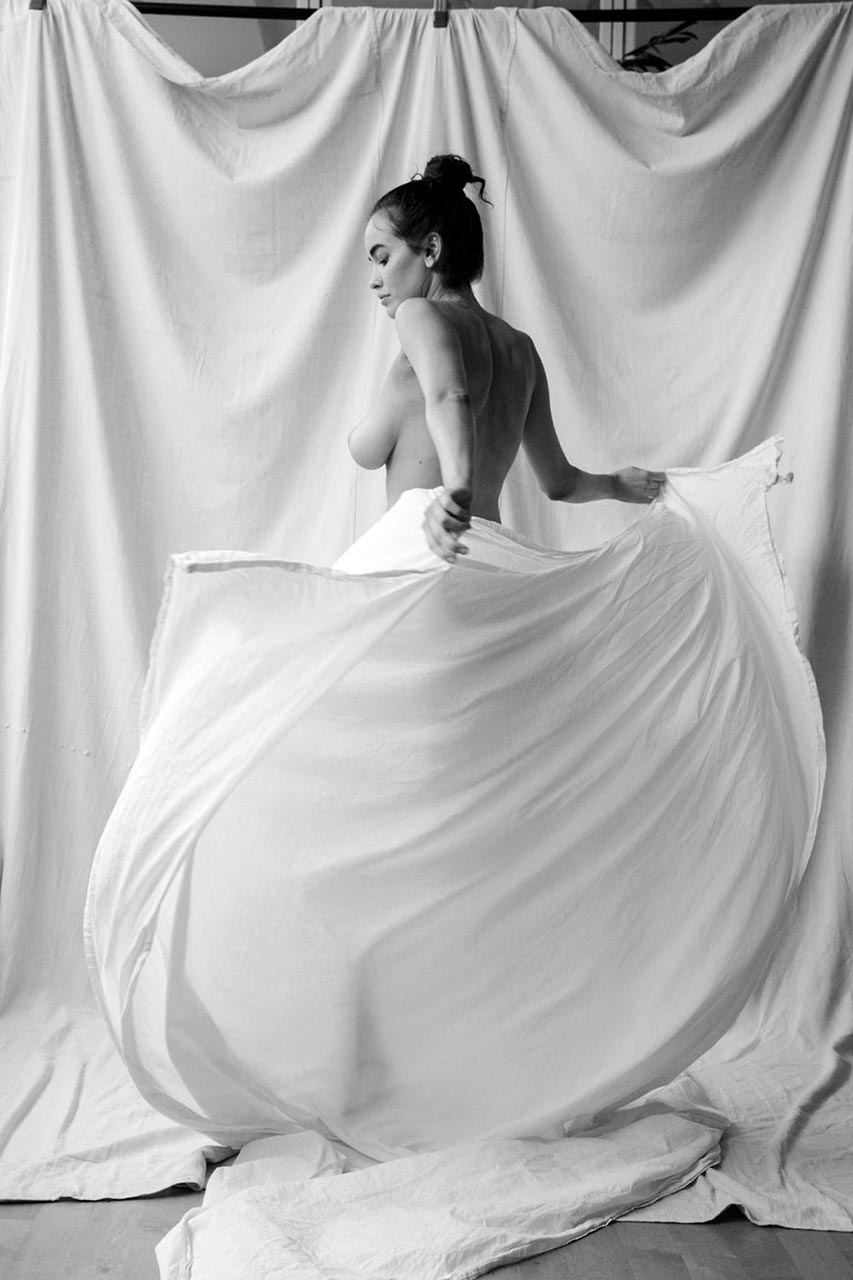 Sarah Stephens nude, standing with the sheet pulled around her