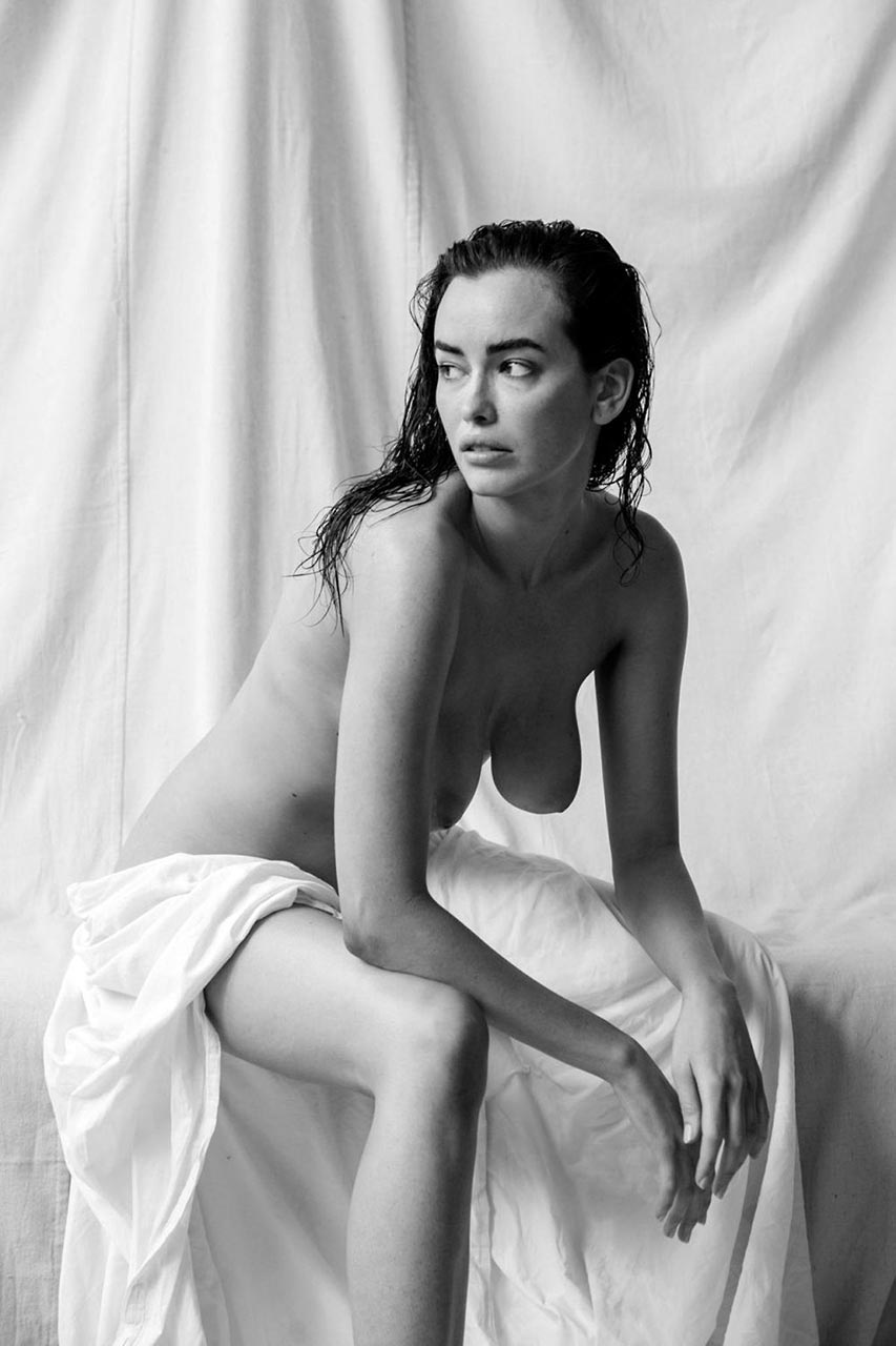 Sarah Stephens nude, seated with the sheet at her waist
